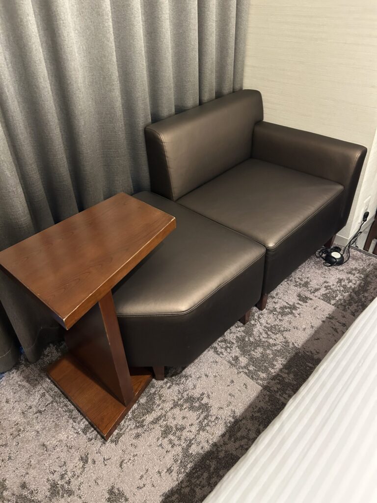 Spacious seating area by the window in the guest room