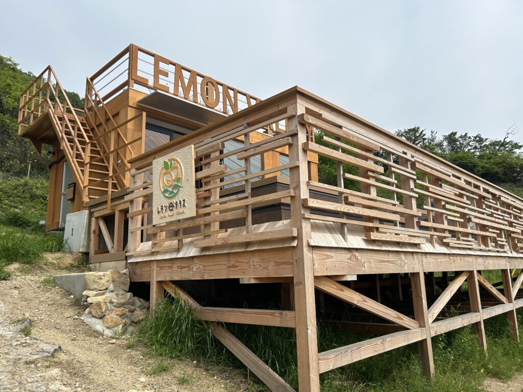 Wooden terrace overlooking lemon orchards on Ikuchijima along the Shimanami Kaido