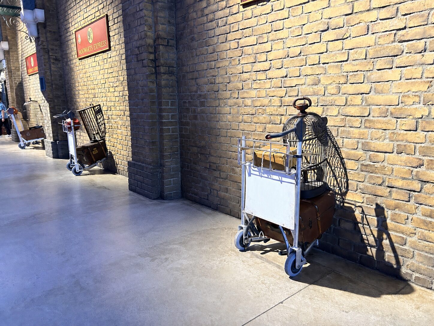 Platform 9¾ luggage trolley against a brick wall at Warner Bros. Studio Tour Tokyo