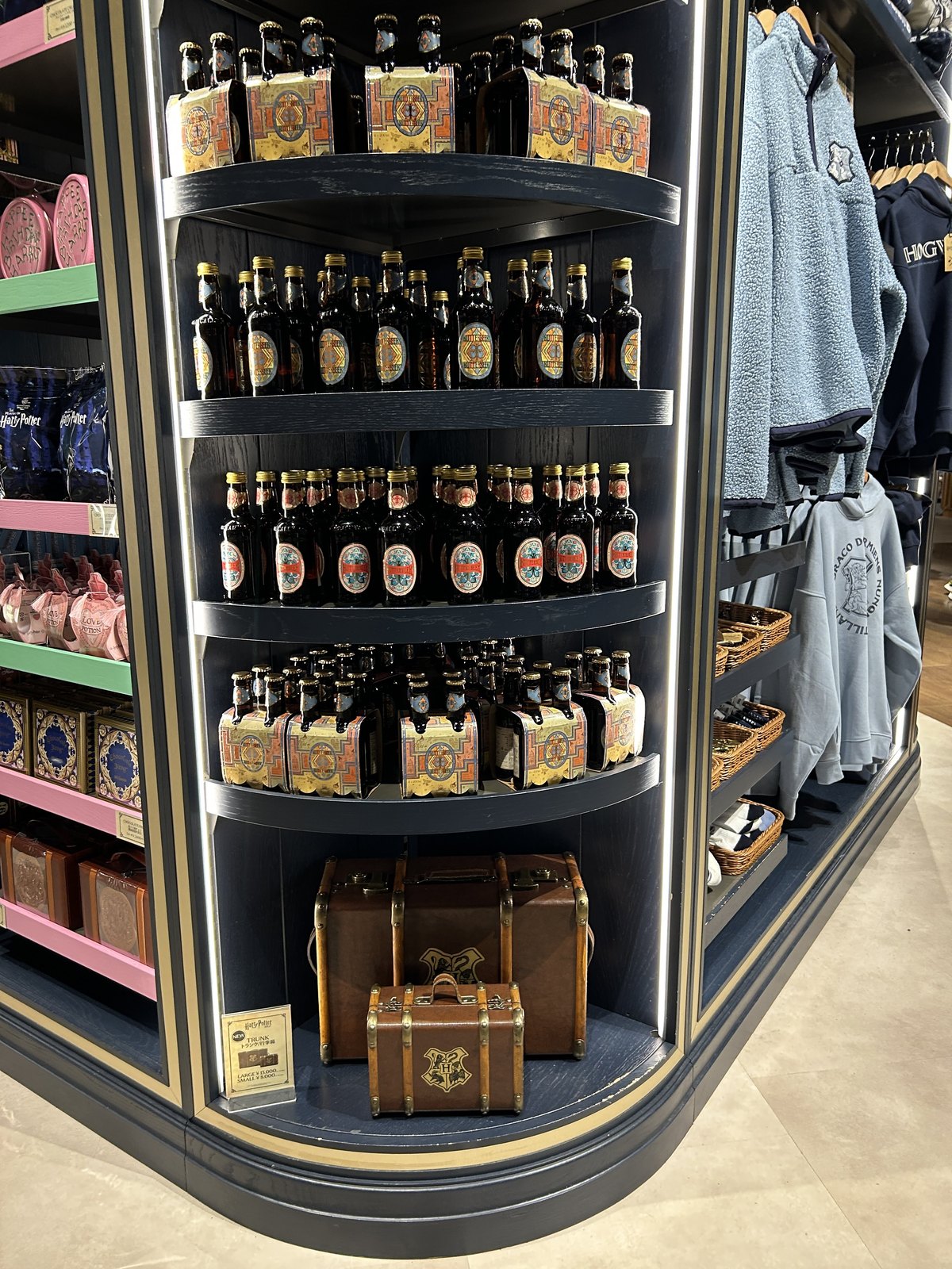 Bottled Butterbeer and Hogwarts trunk-shaped souvenirs displayed in the Studio Shop